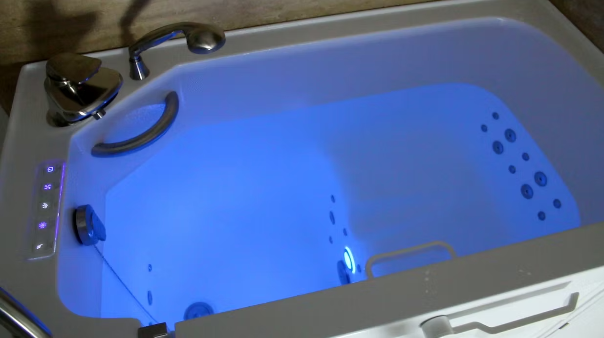 Walk-in tub with chromotherapy blue lighting and hydrotherapy jets