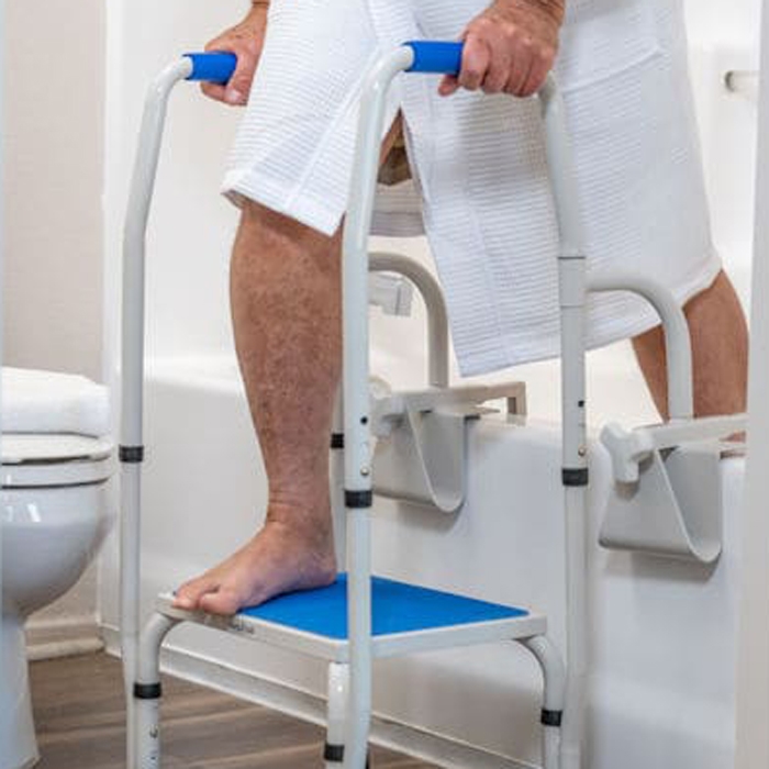 Senior using mobility aid to safely access bathroom with accessibility modifications