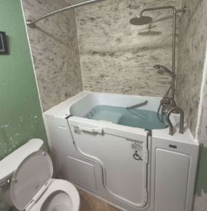 Walk-in tub and shower combo installation with grab bars and marble surround